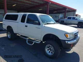 1999 Toyota Tacoma z VIN 4TAWN72N5XZ406015, wystawiony jako IAAI lot #43154475 z przebiegiem 321 963 mil mil oraz . Historia ofert i sprzedaży dostępna na DreamBid. Obrazek 1.
