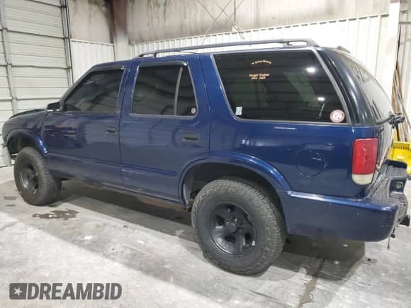 2000 Chevrolet Blazer LS z VIN 1GNCS13W7YK297644, wystawiony jako Copart lot #70089505 z przebiegiem 264 962 mil mil oraz Szkoda całkowita • Salvage title. Historia ofert i sprzedaży dostępna na DreamBid. Obrazek 2.