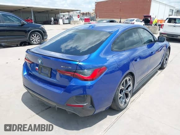 2024 BMW i4 eDrive35 with VIN WBY43AW01RFS40186, listed as a IAAI auction lot 42671776 with 17,942 mi miles and . Bid and sale history available at DreamBid. Image 4.