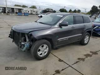 2016 Jeep Grand Cherokee Laredo with VIN 1C4RJFAG8GC390082, listed as a Copart auction lot 82210225 with 215,652 mi miles and Salvage title. Bid and sale history available at DreamBid. Image 1.