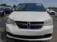 2013 Dodge Grand Caravan SXT with VIN 2C4RDGCG9DR523381, listed as a Copart auction lot 65055335 with 156,250 mi miles and Salvage title. Bid and sale history available at DreamBid. Image 5.