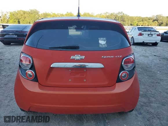 2012 Chevrolet Sonic LTZ с VIN 1G1JF6SH5C4110539, выставлен на аукционе Copart как лот 74803564 с пробегом 147 312 миль миль и Чистый • Clean title. История ставок и продаж доступна на DreamBid. Изображение 6.