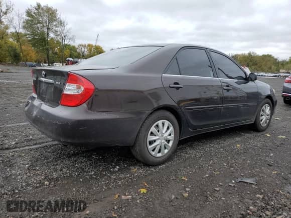 2002 Toyota Camry LE with VIN 4T1BE32K72U508340, listed as a Copart auction lot 86317005 with 216,628 mi miles and Salvage title. Bid and sale history available at DreamBid. Image 3.