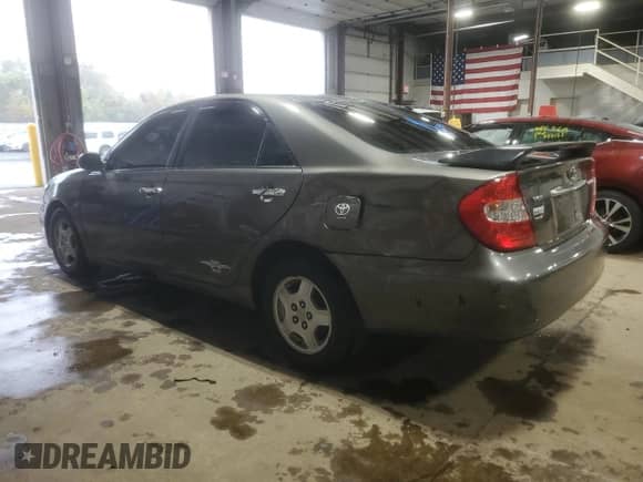 2003 Toyota Camry LE с VIN 4T1BF32K33U548784, выставлен на аукционе Copart как лот 85709875 с пробегом 175 340 миль миль и Списание • Salvage title. История ставок и продаж доступна на DreamBid. Изображение 2.