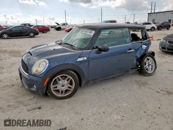 2010 MINI Hardtop S with VIN WMWMF7C51ATZ69061, listed as a Copart auction lot 60837465 with 102,506 mi miles and Salvage title. Bid and sale history available at DreamBid. Image 1.