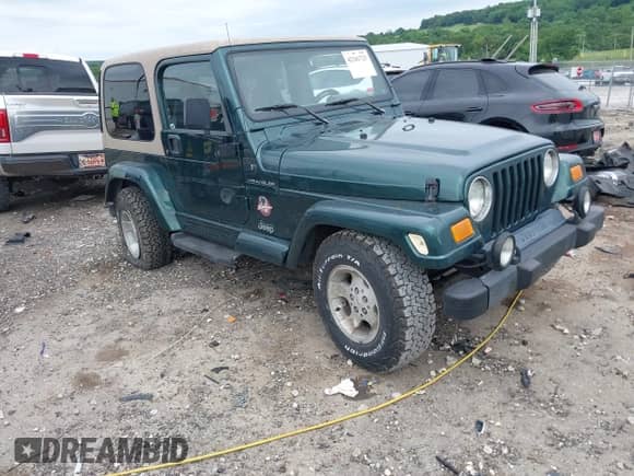 1999 Jeep Wrangler Sahara z VIN 1J4FY49S5XP482037, wystawiony jako IAAI lot #42341723 z przebiegiem 161 081 mil mil oraz . Historia ofert i sprzedaży dostępna na DreamBid. Obrazek 1.