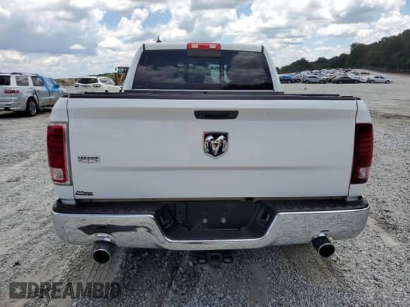 2014 Ram 1500 Laramie z VIN 1C6RR6NT7ES221844, wystawiony jako Copart lot #61636015 z przebiegiem 226 962 mil mil oraz Szkoda całkowita • Salvage title. Historia ofert i sprzedaży dostępna na DreamBid. Obrazek 6.