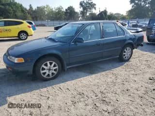 1993 Honda Accord LX with VIN 1HGCB7559PA181884, listed as a Copart auction lot 66642085 with 411,035 mi miles and Salvage title. Bid and sale history available at DreamBid. Image 1.