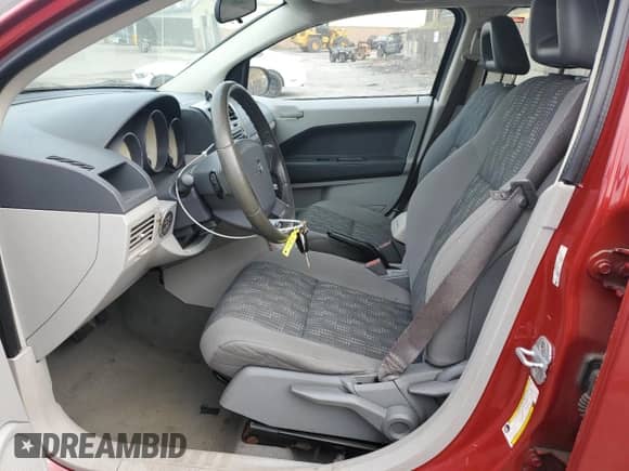 2007 Dodge Caliber SXT with VIN 1B3HB48B27D150528, listed as a Copart auction lot 80480025 with 121,779 mi miles and Salvage title. Bid and sale history available at DreamBid. Image 7.