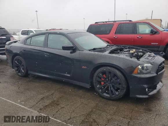 2014 Dodge Charger SRT-8 с VIN 2C3CDXEJ2EH205550, выставлен на аукционе Copart как лот 86244474 с пробегом 98 822 миль миль и Списание • Salvage title. История ставок и продаж доступна на DreamBid. Изображение 4.