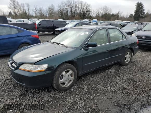 2000 Honda Accord EX with VIN JHMCG5667YC002080, listed as a Copart auction lot 45941365 with 210,279 mi miles and Salvage title. Bid and sale history available at DreamBid. Image 1.