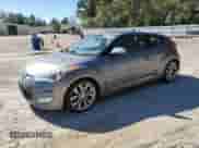 2013 Hyundai Veloster w/Black Int z VIN KMHTC6AD2DU144524, wystawiony jako Copart lot #86604965 z przebiegiem 101 979 mil mil oraz Czysty tytuł • Clean title. Historia ofert i sprzedaży dostępna na DreamBid. Obrazek 1.