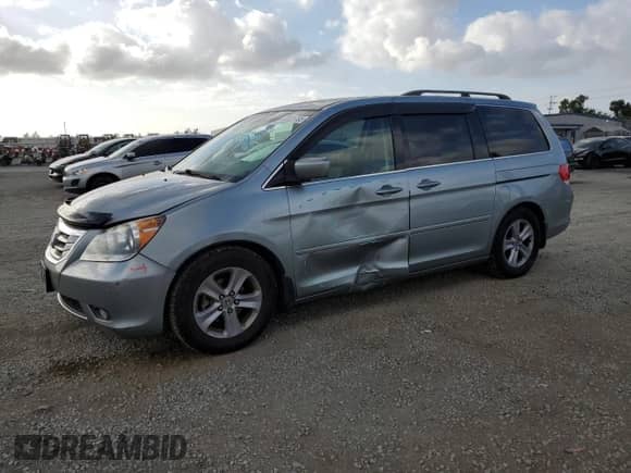 2009 Honda Odyssey Touring with VIN 5FNRL38989B040375, listed as a Copart auction lot 82321765 with 167,692 mi miles and Salvage title. Bid and sale history available at DreamBid. Image 1.