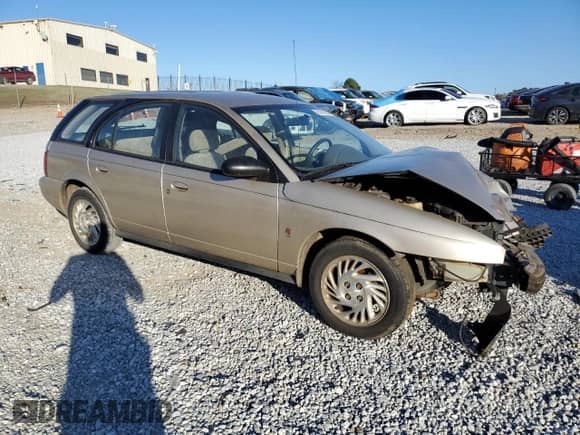 1999 Saturn SW with VIN 1G8ZK8277XZ162136, listed as a Copart auction lot 83206604 with Not provided miles and Salvage title. Bid and sale history available at DreamBid. Image 4.
