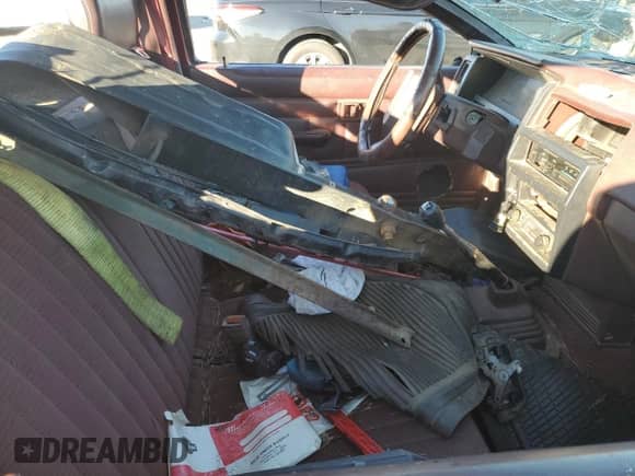 1990 Nissan Frontier z VIN 1N6SD11S6LC409798, wystawiony jako Copart lot #87842705 z przebiegiem Nie podano mil oraz Szkoda całkowita • Salvage title. Historia ofert i sprzedaży dostępna na DreamBid. Obrazek 10.