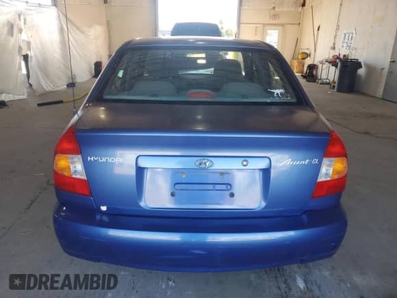 2000 Hyundai Accent z VIN KMHCG45G6YU066218, wystawiony jako Copart lot #84948715 z przebiegiem 110 059 mil mil oraz Szkoda całkowita • Salvage title. Historia ofert i sprzedaży dostępna na DreamBid. Obrazek 6.