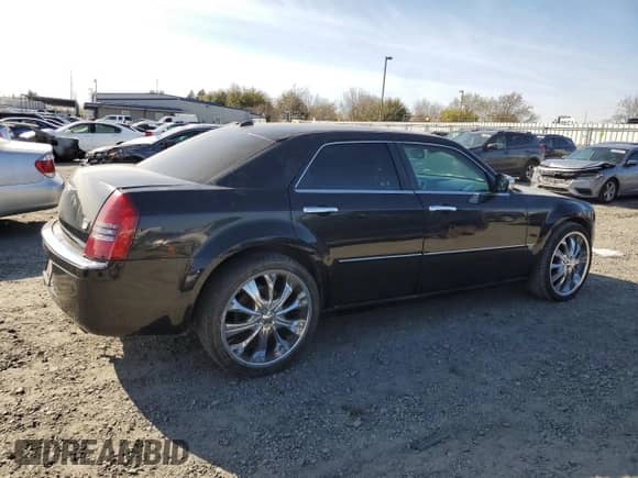2005 Chrysler 300 300C AWD with VIN 2C3AK63H55H672324, listed as a Copart auction lot 48790925 with 258,543 mi miles and Salvage title. Bid and sale history available at DreamBid. Image 3.