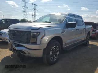 2023 Ford F-150 Lightning Pro with VIN 1FTVW1EL0PWG25972, listed as a Copart auction lot 68367235 with 26,478 mi miles and Salvage title. Bid and sale history available at DreamBid. Image 1.