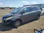 2014 Toyota Sienna XLE with VIN 5TDYK3DC8ES455816, listed as a Copart auction lot 71400095 with 158,635 mi miles and Salvage title. Bid and sale history available at DreamBid. Image 1.