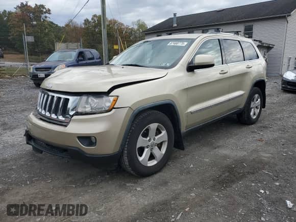 2012 Jeep Grand Cherokee Laredo z VIN 1C4RJFAG0CC156397, wystawiony jako Copart lot #87400775 z przebiegiem 165 192 mil mil oraz Szkoda całkowita • Salvage title. Historia ofert i sprzedaży dostępna na DreamBid. Obrazek 1.