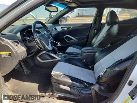 2016 Hyundai Veloster z VIN KMHTC6AD3GU253420, wystawiony jako Copart lot #68296565 z przebiegiem 123 210 mil mil oraz Szkoda całkowita • Salvage title. Historia ofert i sprzedaży dostępna na DreamBid. Obrazek 7.