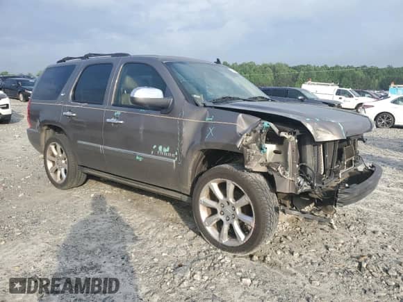 2012 Chevrolet Tahoe LTZ с VIN 1GNSCCE0XCR110507, выставлен на аукционе Copart как лот 54269535 с пробегом 193 499 миль миль и Списание • Salvage title. История ставок и продаж доступна на DreamBid. Изображение 4.
