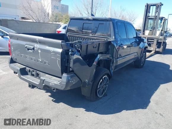 2024 Toyota Tacoma SR5 with VIN 3TMLB5JN5RM051339, listed as a IAAI auction lot 41241754 with 7,181 mi miles and . Bid and sale history available at DreamBid. Image 4.