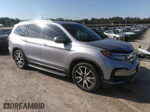 2021 Honda Pilot Touring 7-Passenger with VIN 5FNYF5H69MB000710, listed as a IAAI auction lot 43081838 with 91,899 mi miles and . Bid and sale history available at DreamBid. Image 1.
