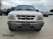 2000 Ford Explorer Sport z VIN 1FMYU60E0YUA70071, wystawiony jako Copart lot #54078615 z przebiegiem 189 103 mil mil oraz Czysty tytuł • Clean title. Historia ofert i sprzedaży dostępna na DreamBid. Obrazek 5.