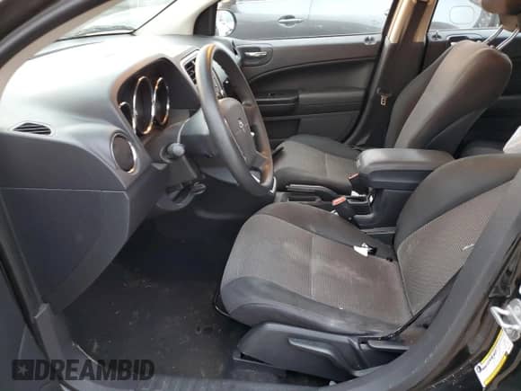 2010 Dodge Caliber Mainstreet with VIN 1B3CB3HAXAD551716, listed as a Copart auction lot 77349503 with 144,209 mi miles and Salvage title. Bid and sale history available at DreamBid. Image 7.