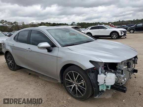 2023 Toyota Camry SE with VIN 4T1G11AK4PU809954, listed as a Copart auction lot 71636965 with 12,236 mi miles and Salvage title. Bid and sale history available at DreamBid. Image 4.