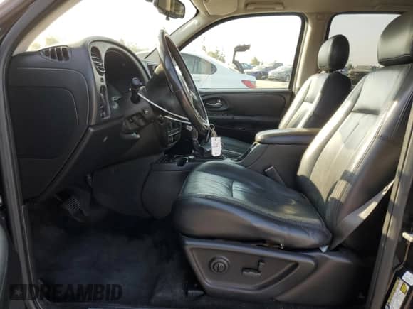2005 Chevrolet TrailBlazer LT with VIN 1GNES16SX56180758, listed as a Copart auction lot 64701205 with 151,000 mi miles and Salvage title. Bid and sale history available at DreamBid. Image 7.