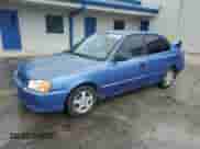 2002 Hyundai Accent GL z VIN KMHCG45C52U288494, wystawiony jako Copart lot #64835465 z przebiegiem 124 538 mil mil oraz Szkoda całkowita • Salvage title. Historia ofert i sprzedaży dostępna na DreamBid. Obrazek 1.