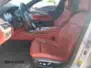 2017 BMW 7 Series 740e xDrive with VIN WBA7J2C3XHG497958, listed as a Copart auction lot 58203604 with 75,256 mi miles and Salvage title. Bid and sale history available at DreamBid. Image 7.