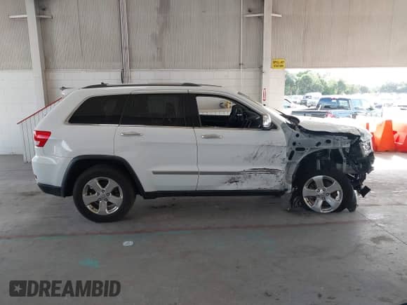 2013 Jeep Grand Cherokee Limited z VIN 1C4RJEBG6DC595730, wystawiony jako IAAI lot #43418036 z przebiegiem 163 431 mil mil oraz . Historia ofert i sprzedaży dostępna na DreamBid. Obrazek 13.