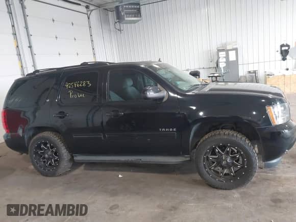 2014 Chevrolet Tahoe LT with VIN 1GNSCBE07ER249202, listed as a IAAI auction lot 42546283 with 124,538 mi miles and . Bid and sale history available at DreamBid. Image 14.
