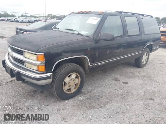 1994 Chevrolet Suburban z VIN 1GNFK16K4RJ369347, wystawiony jako IAAI lot #43410847 z przebiegiem 170 840 mil mil oraz . Historia ofert i sprzedaży dostępna na DreamBid. Obrazek 2.