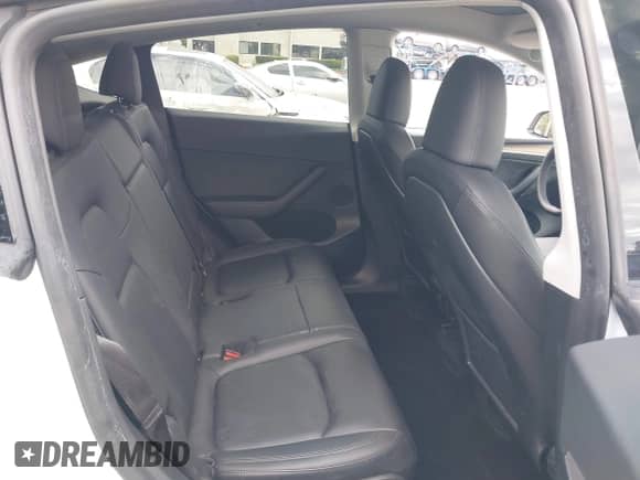 2023 Tesla Model Y Long Range with VIN 7SAYGAEE2PF763662, listed as a IAAI auction lot 43412618 with 43,857 mi miles and . Bid and sale history available at DreamBid. Image 8.