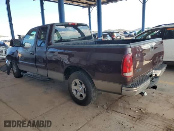 2001 Ford F-150 XL with VIN 1FTZX17241NB72469, listed as a Copart auction lot 71725925 with 236,694 mi miles and Salvage title. Bid and sale history available at DreamBid. Image 2.