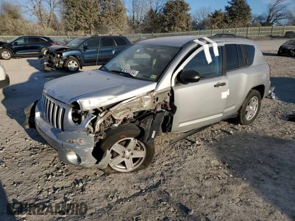 2010 Jeep Compass Sport z VIN 1J4NT1FB9AD626226, wystawiony jako Copart lot #82933784 z przebiegiem 191 772 mil mil oraz Szkoda całkowita • Salvage title. Historia ofert i sprzedaży dostępna na DreamBid. Obrazek 1.