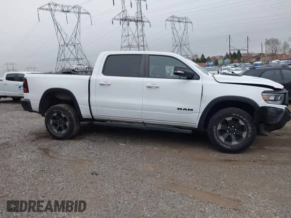 2019 Ram 1500 Rebel z VIN 1C6SRFLT9KN550608, wystawiony jako IAAI lot #41937627 z przebiegiem 8 059 mil mil oraz . Historia ofert i sprzedaży dostępna na DreamBid. Obrazek 14.