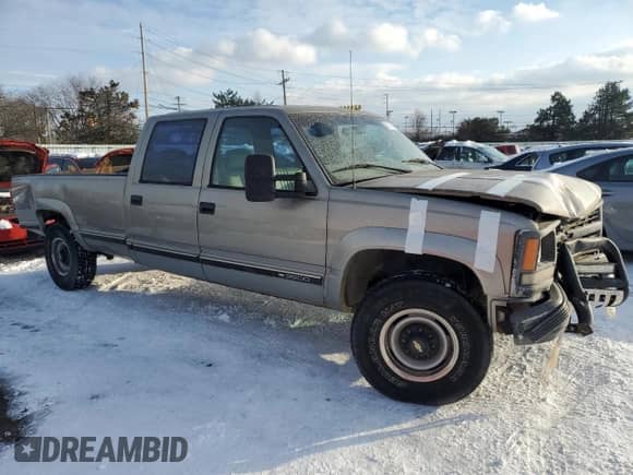 1999 Chevrolet Silverado 3500 z VIN 1GCHK33R4XF096473, wystawiony jako Copart lot #87587465 z przebiegiem 174 424 mil mil oraz Szkoda całkowita • Salvage title. Historia ofert i sprzedaży dostępna na DreamBid. Obrazek 4.