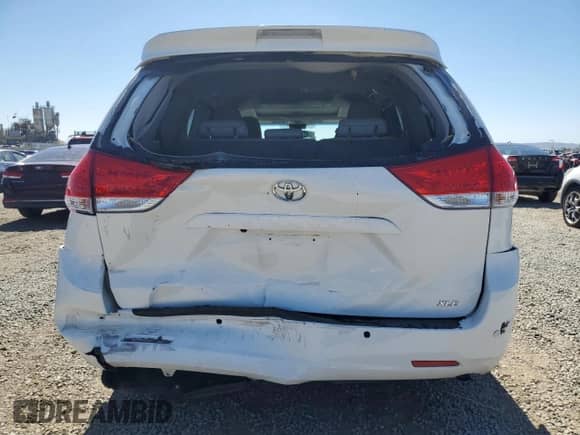 2011 Toyota Sienna XLE AAS with VIN 5TDYK3DC8BS174661, listed as a Copart auction lot 84907795 with 212,001 mi miles and Salvage title. Bid and sale history available at DreamBid. Image 6.