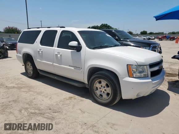 2007 Chevrolet Suburban LS с VIN 1GNFC16J47R248109, выставлен на аукционе Copart как лот 65605015 с пробегом Не указан миль и Списание • Salvage title. История ставок и продаж доступна на DreamBid. Изображение 4.