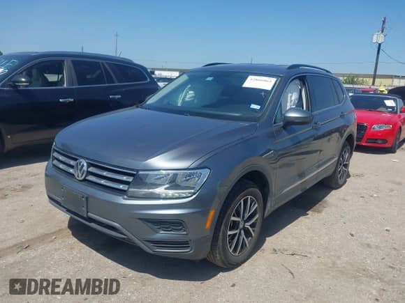 2021 Volkswagen Tiguan SE with VIN 3VV3B7AX3MM060953, listed as a IAAI auction lot 42866063 with 64,109 mi miles and . Bid and sale history available at DreamBid. Image 2.