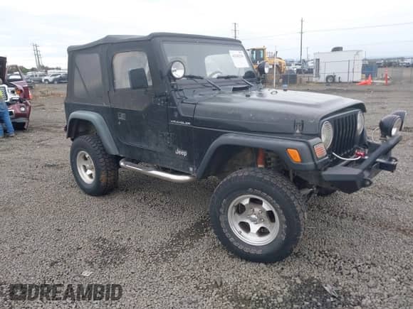 1998 Jeep Wrangler SE z VIN 1J4FY29P6WP765254, wystawiony jako IAAI lot #43342210 z przebiegiem 128 384 mil mil oraz . Historia ofert i sprzedaży dostępna na DreamBid. Obrazek 1.