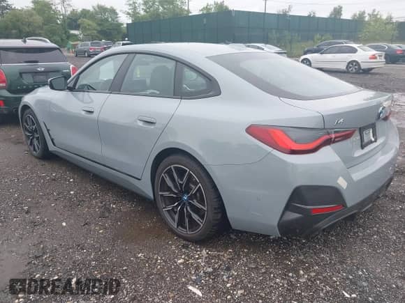 2022 BMW i4 eDrive40 with VIN WBY73AW00NFN14842, listed as a IAAI auction lot 42313404 with 23,556 mi miles and . Bid and sale history available at DreamBid. Image 3.