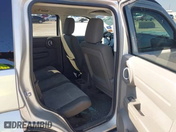 2009 Dodge Nitro SE z VIN 1D8GT28K99W513413, wystawiony jako IAAI lot #39462494 z przebiegiem 196 456 mil mil oraz . Historia ofert i sprzedaży dostępna na DreamBid. Obrazek 8.