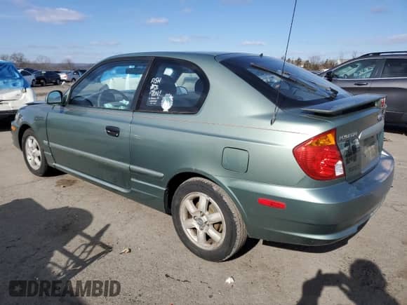 2003 Hyundai Accent GL z VIN KMHCG35CX3U242820, wystawiony jako Copart lot #45971325 z przebiegiem 132 192 mil mil oraz Szkoda całkowita • Salvage title. Historia ofert i sprzedaży dostępna na DreamBid. Obrazek 2.