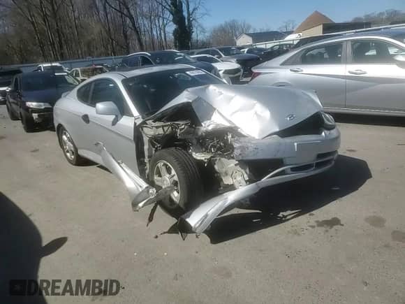 2003 Hyundai Tiburon с VIN KMHHM65D03U056017, выставлен на аукционе Copart как лот 49678695 с пробегом 99 729 миль миль и Списание • Salvage title. История ставок и продаж доступна на DreamBid. Изображение 11.